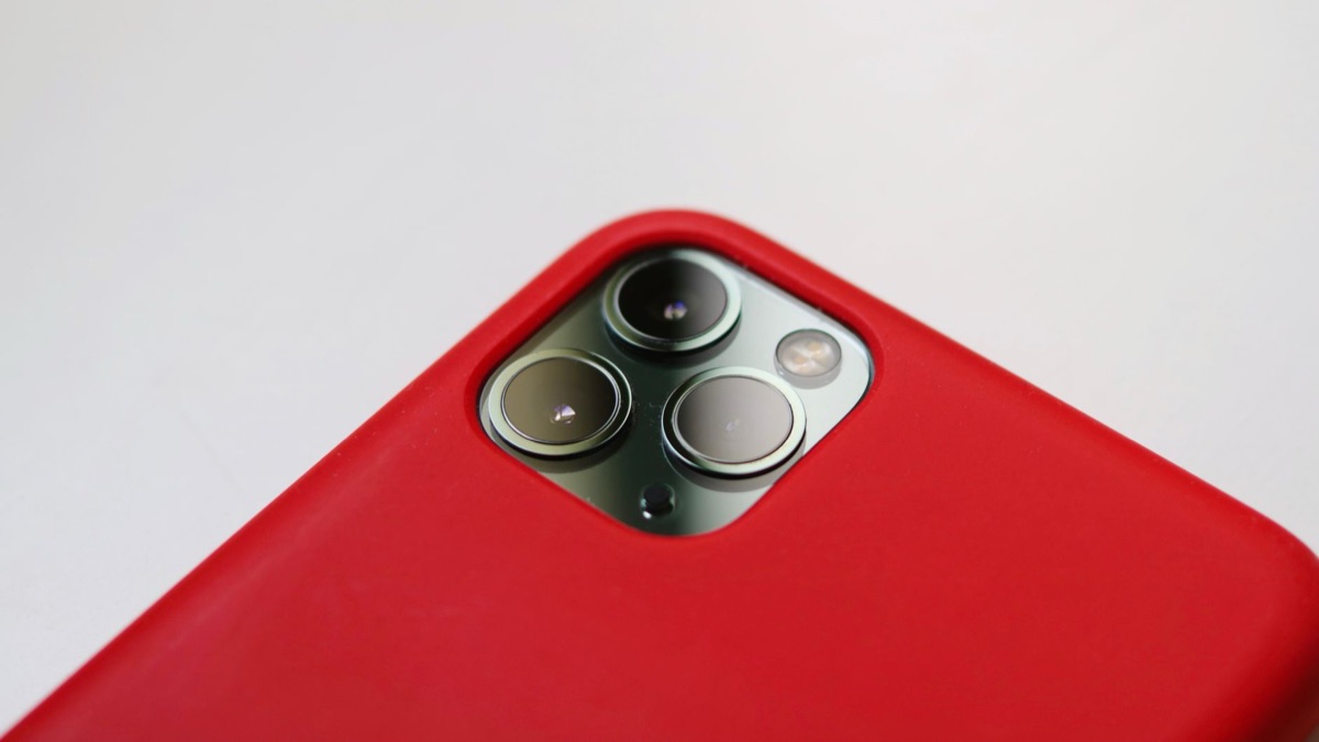 Smartphone camera lens on a dark surface