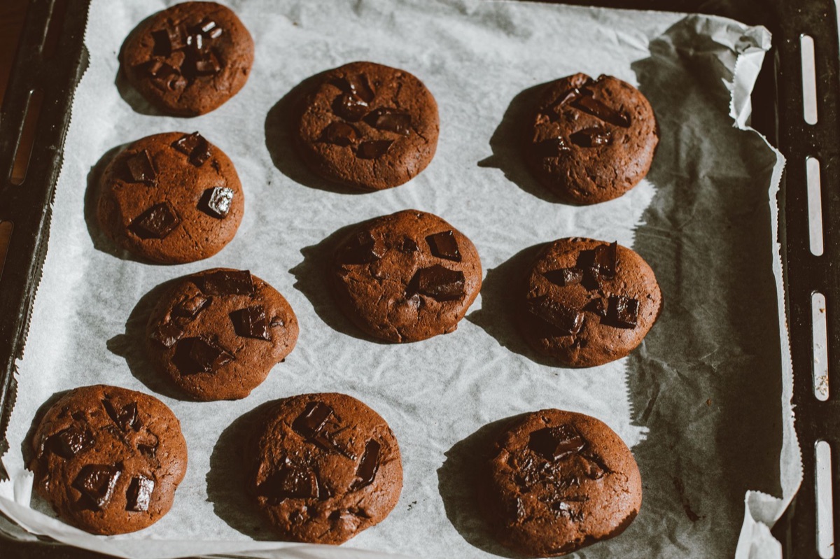 baking sheet with cookies in oven