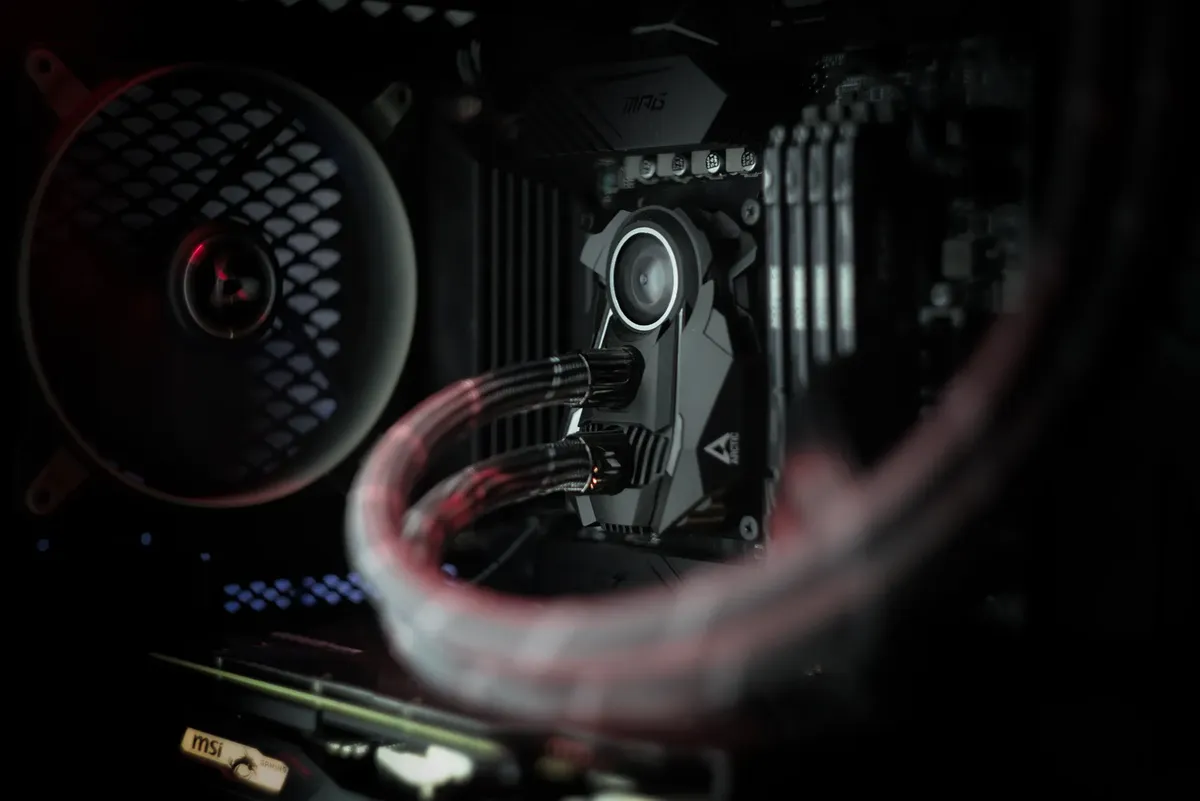 Detailed view of a computer's cooling system showcasing advanced technology with illuminated components.